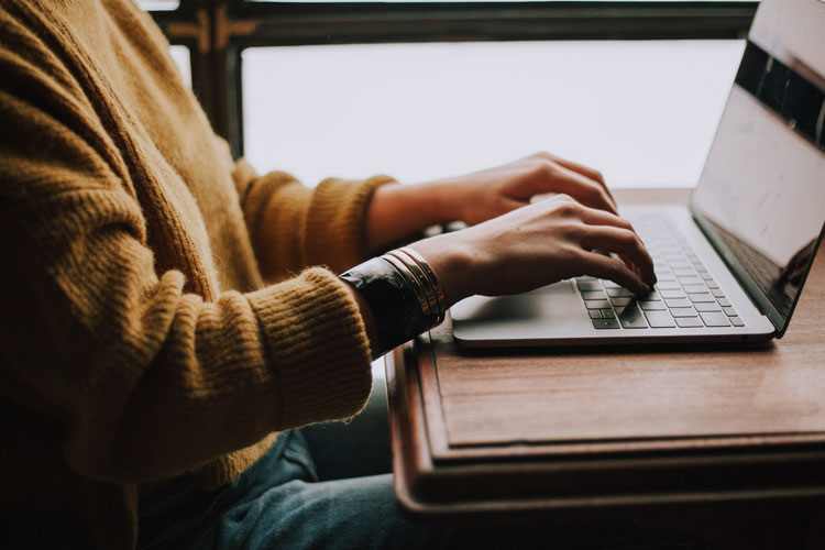 Man is Using Laptop in the Office Comfortably